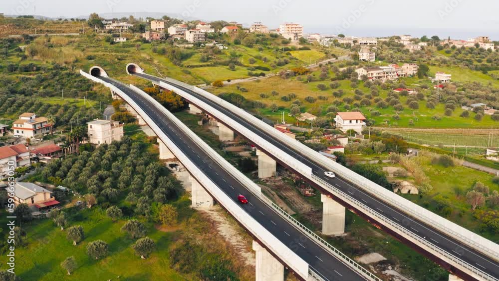 Cars pass on the highway viaduct Cars pass on the highway viaduct