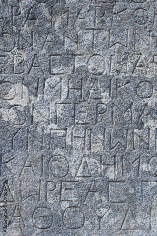 Greek letters stone background
