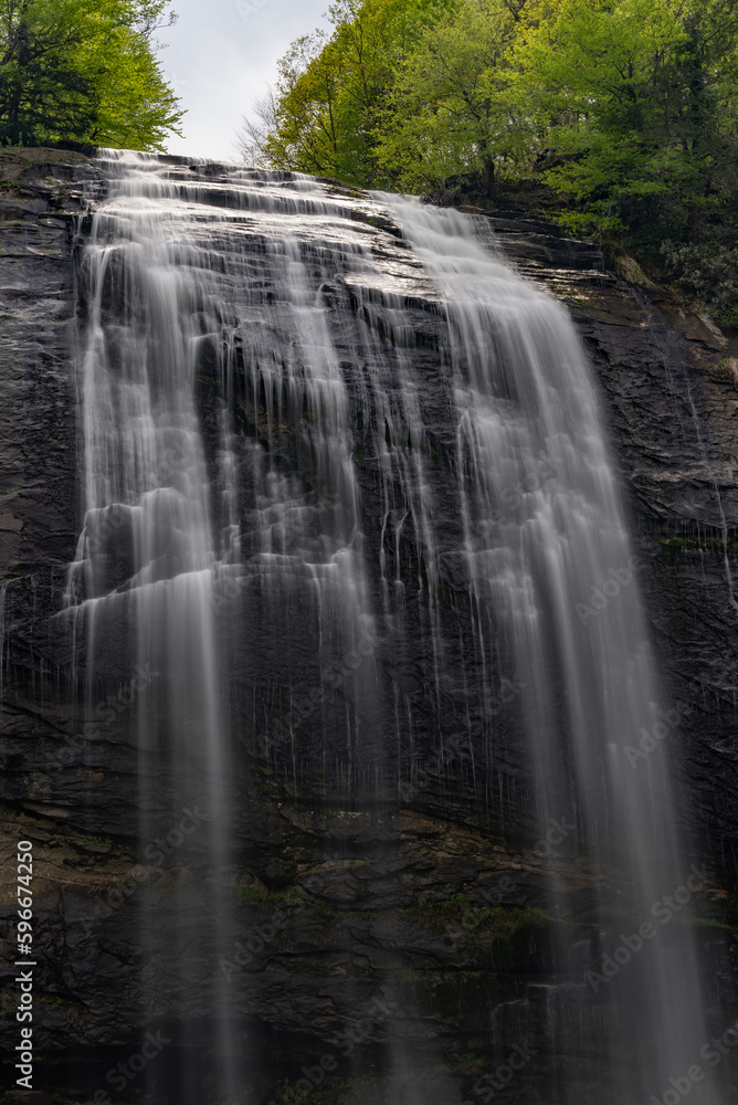 Fototapeta premium Beautiful waterfall in wild jungle forest. Travel and adventure landscape.