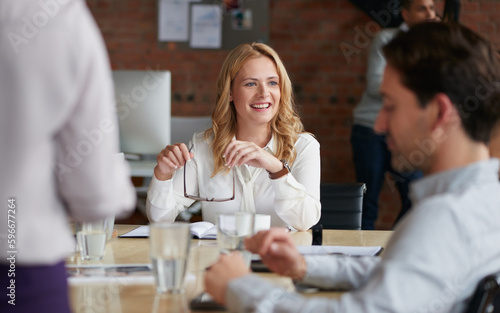 Inspired to keep crafting success with her team. Shot of a young businesswoman having a meeting with her colleagues in an office.