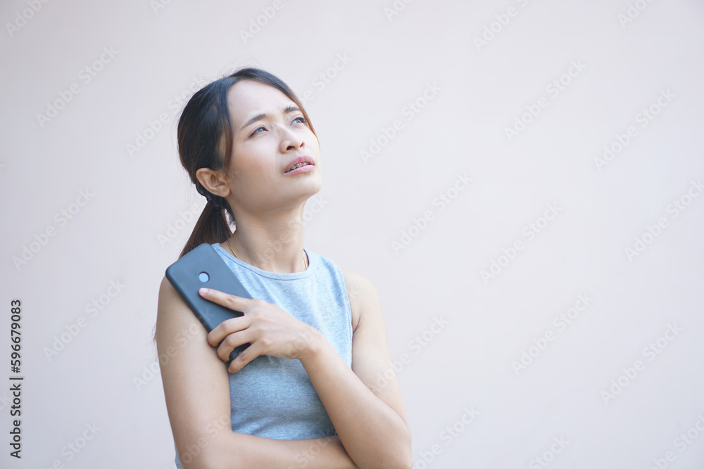 woman looking at phone Disappointed with declining profits woman looking at phone Disappointed with declining profits