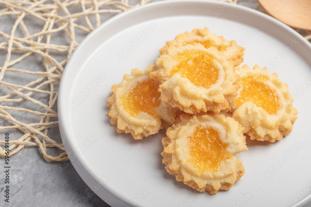 Orange cookies on a white plate