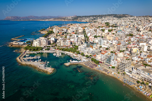 Aerial view of a busy beach in the popular resort town of Nea Chora in Chania, Crete (Greece)