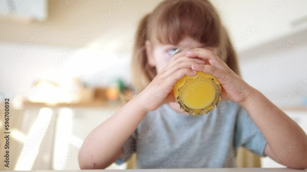 children drink juice. group of children drinking juice in the kitchen morning breakfast a before school. happy family lifestyle kid dream concept. orange juice healthy food. kids drink juice children drink juice. group of children drinking juice in the kitchen morning breakfast a before school. happy family lifestyle kid dream concept. orange juice healthy food. kids drink juice