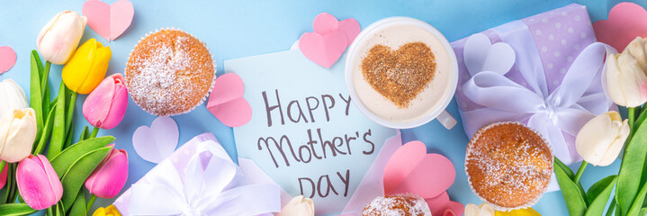 Mother's day holiday greeting card. Mother's Day morning breakfast with a cute surprise background, with gift boxes, cupcakes, coffee mug, heart decor, tulips and flowers, Happy Mother's Day letter