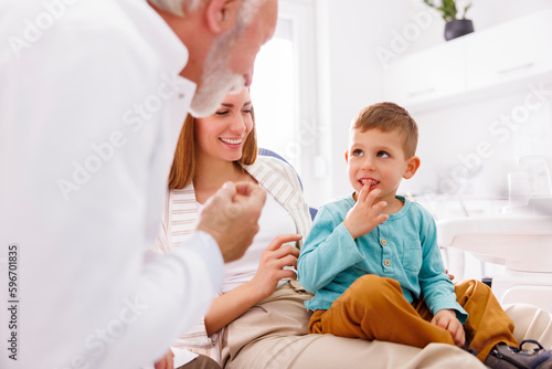 Little boy having checkup at dentist office