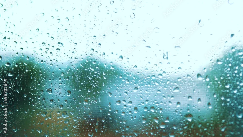 raindrop on the window in autumn a background. wet glass rain drops rainy sky blurred background close-up. rain in the window on the background of the sky blurred lifestyle plan raindrop on the window in autumn a background. wet glass rain drops rainy sky blurred background close-up. rain in the window on the background of the sky blurred lifestyle plan