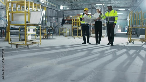 Wallpaper Mural Three people moving across workplace during workflow working time. Hard-working male African-American worker gesticulating. Concerned Caucasian female and busy Asian man nodding. Torontodigital.ca