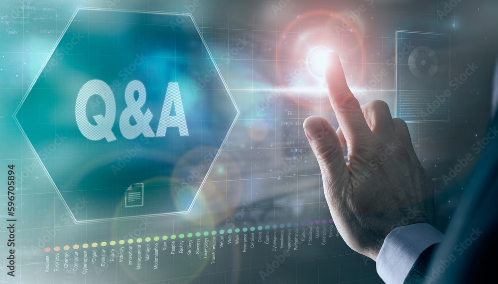 A businessman controlling a futuristic display with a Questions and Answers, Q&A, business concept on it. A businessman controlling a futuristic display with a Questions and Answers, Q&A, business concept on it.
