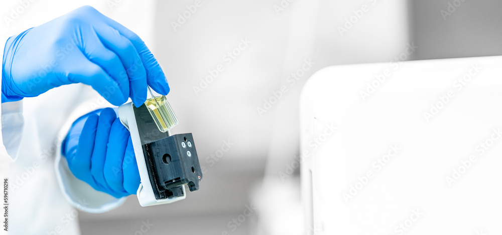 examination of a chemical sample using modern devices in the biochemical laboratory of the research institute examination of a chemical sample using modern devices in the biochemical laboratory of the research institute