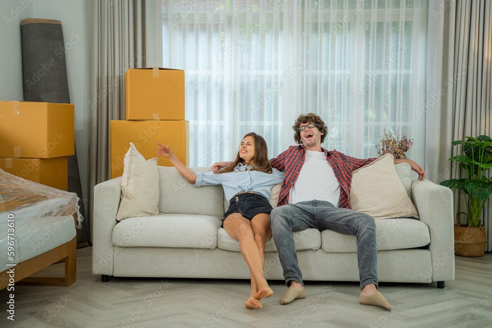 Young couple Carrying Boxes Into New Home On Moving Day,Real Estate, Mortgage. Young couple Carrying Boxes Into New Home On Moving Day,Real Estate, Mortgage.