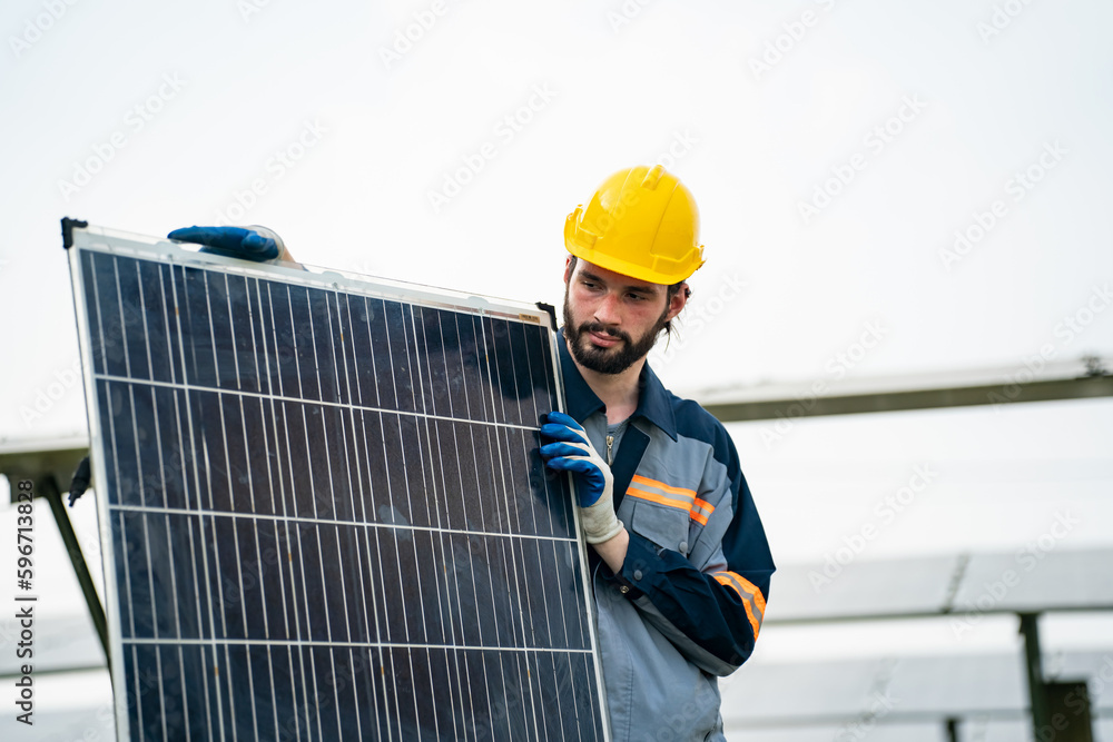 Engineer hand is installing and checking an operation of sun and cleanliness of photovoltaic solar panels, Engineer with energy measurement tool photovoltaic modules for renewable energy Engineer hand is installing and checking an operation of sun and cleanliness of photovoltaic solar panels, Engineer with energy measurement tool photovoltaic modules for renewable energy