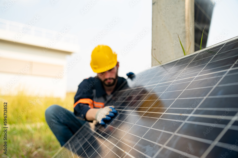Engineer hand is installing and checking an operation of sun and cleanliness of photovoltaic solar panels, Engineer with energy measurement tool photovoltaic modules for renewable energy Engineer hand is installing and checking an operation of sun and cleanliness of photovoltaic solar panels, Engineer with energy measurement tool photovoltaic modules for renewable energy