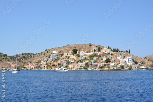 A view of the town of Symi island in Greece from the sea, copy space 