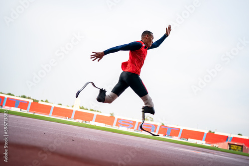 athlete runner physically disabled run on track of stadium