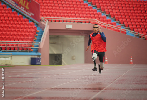 athlete runner physically disabled run on track of stadium