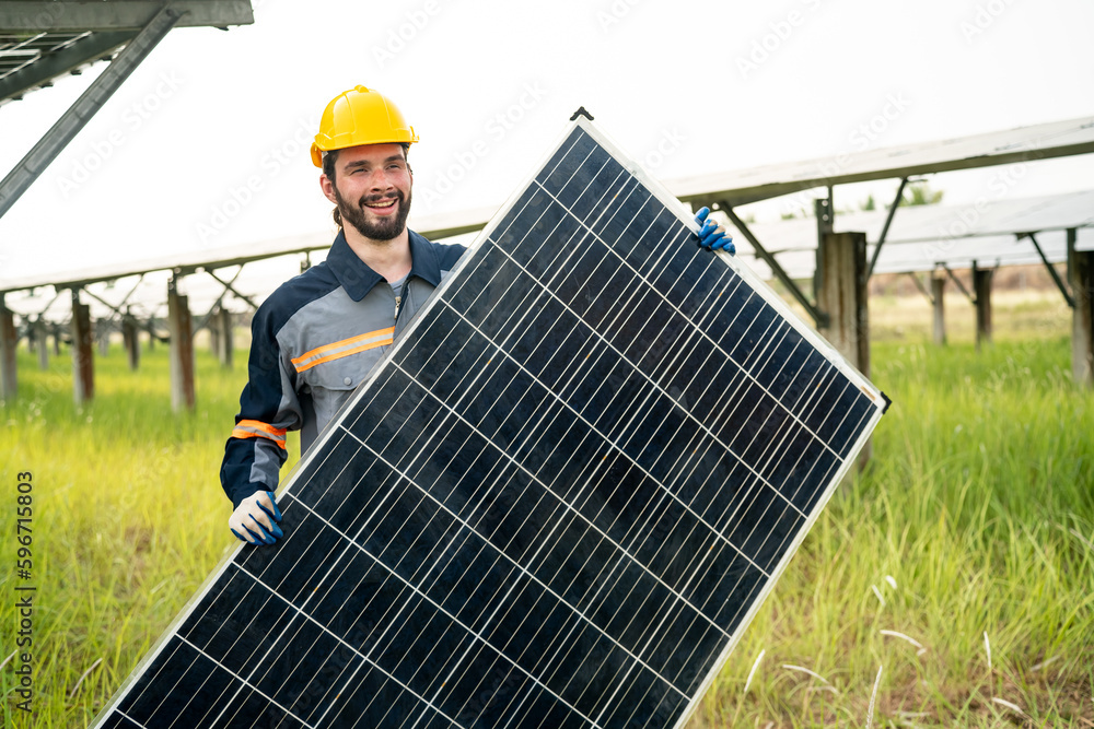 Engineer hand is installing and checking an operation of sun and cleanliness of photovoltaic solar panels, Engineer with energy measurement tool photovoltaic modules for renewable energy Engineer hand is installing and checking an operation of sun and cleanliness of photovoltaic solar panels, Engineer with energy measurement tool photovoltaic modules for renewable energy