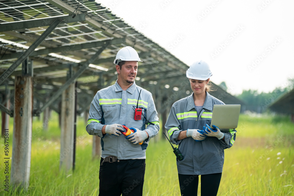 Engineer hand is installing and checking an operation of sun and cleanliness of photovoltaic solar panels, Engineer with energy measurement tool photovoltaic modules for renewable energy Engineer hand is installing and checking an operation of sun and cleanliness of photovoltaic solar panels, Engineer with energy measurement tool photovoltaic modules for renewable energy