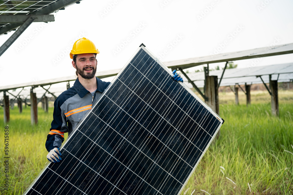 Engineer hand is installing and checking an operation of sun and cleanliness of photovoltaic solar panels, Engineer with energy measurement tool photovoltaic modules for renewable energy Engineer hand is installing and checking an operation of sun and cleanliness of photovoltaic solar panels, Engineer with energy measurement tool photovoltaic modules for renewable energy