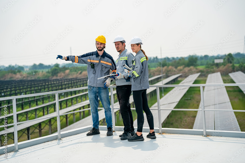 Engineer hand is installing and checking an operation of sun and cleanliness of photovoltaic solar panels, Engineer with energy measurement tool photovoltaic modules for renewable energy Engineer hand is installing and checking an operation of sun and cleanliness of photovoltaic solar panels, Engineer with energy measurement tool photovoltaic modules for renewable energy