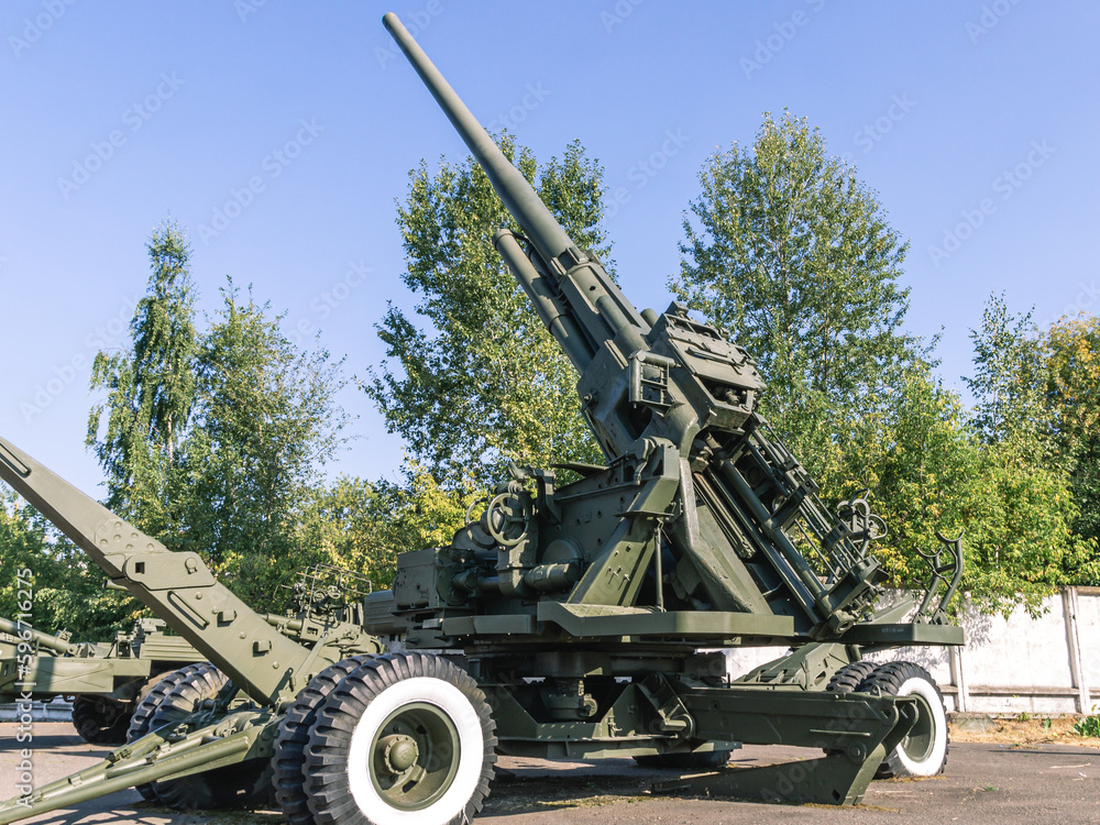 Soviet anti-aircraft gun. Anti-aircraft gun in the marching position. Towed wheeled gun. Armament of the army. Conflicts between countries. Soviet anti-aircraft gun. Anti-aircraft gun in the marching position. Towed wheeled gun. Armament of the army. Conflicts between countries.