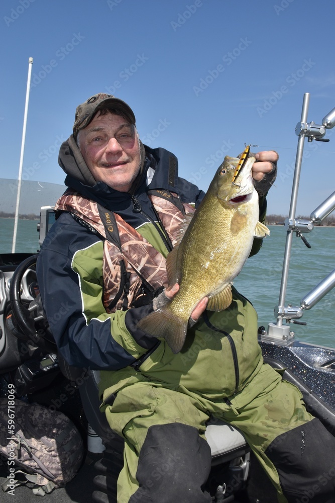 Angler with a smallmouth bass Angler with a smallmouth bass