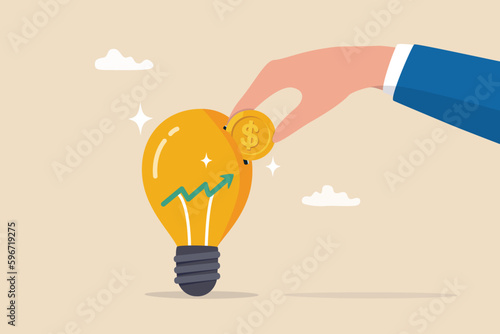 Invest in growth stock, mutual fund or growing money, savings, pension fund or increase return from stock market, economy or rising interest rate, businessman hand put coin in growth graph lightbulb.