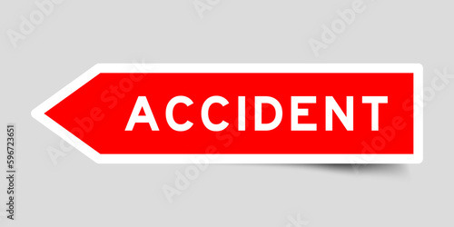 Red color arrow shape sticker label with word accident on gray background