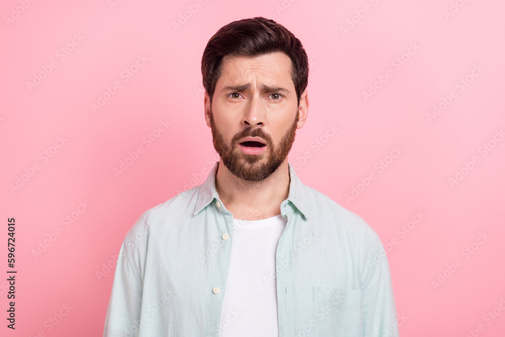 Photo portrait of nice young male sad face disappointed depressed dressed stylish blue garment isolated on pink color background Photo portrait of nice young male sad face disappointed depressed dressed stylish blue garment isolated on pink color background
