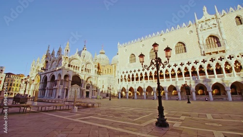 Footbridges and streetlights near old Doge palace on square photo