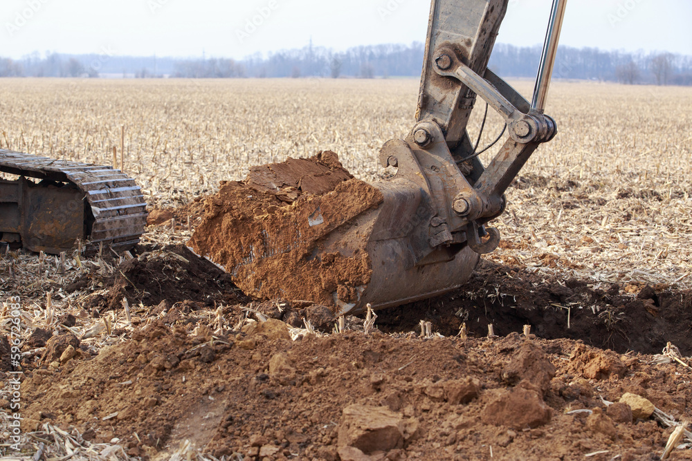 Excavator boom and bucket