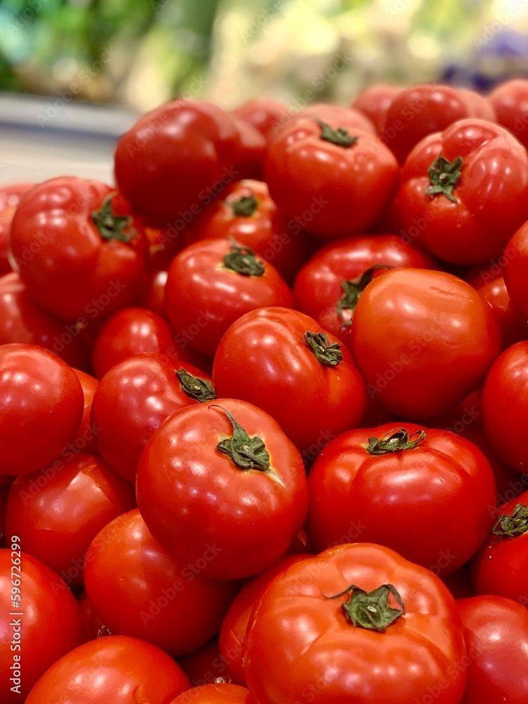 group of fresh tomatoes at the supermarket group of fresh tomatoes at the supermarket