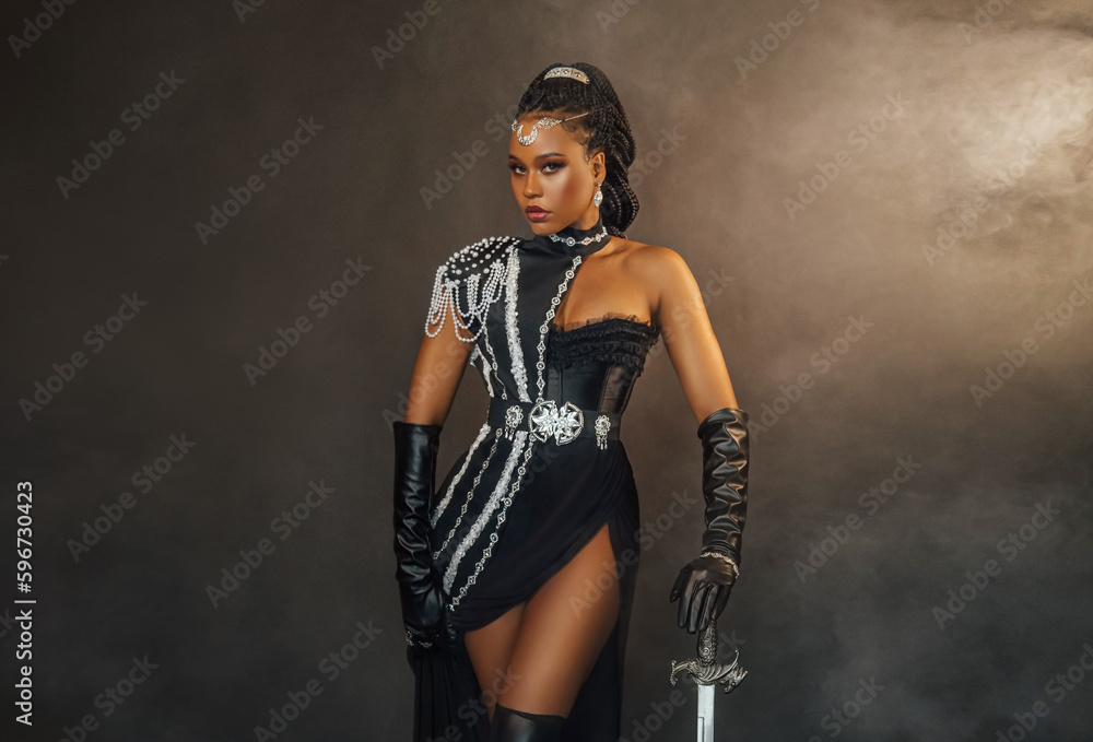 Portrait fantasy african american woman dark queen warrior in black dress  costume. Gothic lady fairy priestess of moon silver tiara. Sexy girl  goddess beauty face fashion model posing. Studio photo. Stock Photo