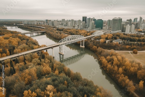 Drone view of autumnal North Saskatchewan river & downtown Edmonton from Rossdale with James MacDonald bridge. Generative AI