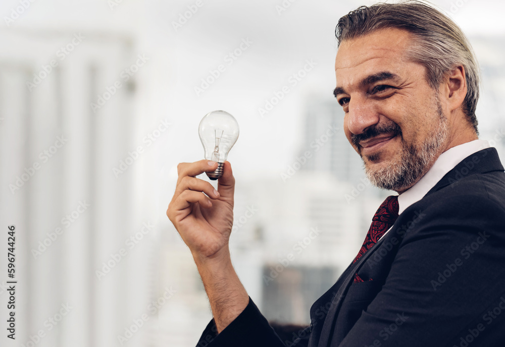 Businessman holding light bulb. Idea concept with innovation and inspiration. businessman holding illuminated light bulb. Brain creative thinking ideas and innovation concept. Businessman holding light bulb. Idea concept with innovation and inspiration. businessman holding illuminated light bulb. Brain creative thinking ideas and innovation concept.