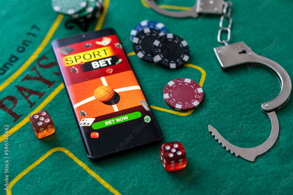 Casino chips a winning combination of cards flush royal next to the police handcuffs Casino chips a winning combination of cards flush royal next to the police handcuffs