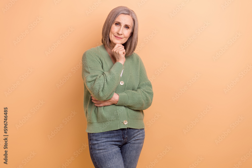 Portrait of thoughtful woman with bob hairstyle wear knit pullover hand on chin think business isolated on pastel color background Portrait of thoughtful woman with bob hairstyle wear knit pullover hand on chin think business isolated on pastel color background