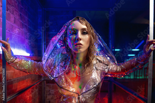 girl in neon light with glowing paints