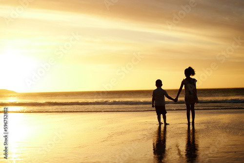 Hearts sing of purity. Shot of an adorable brother and sister bonding at the beach.