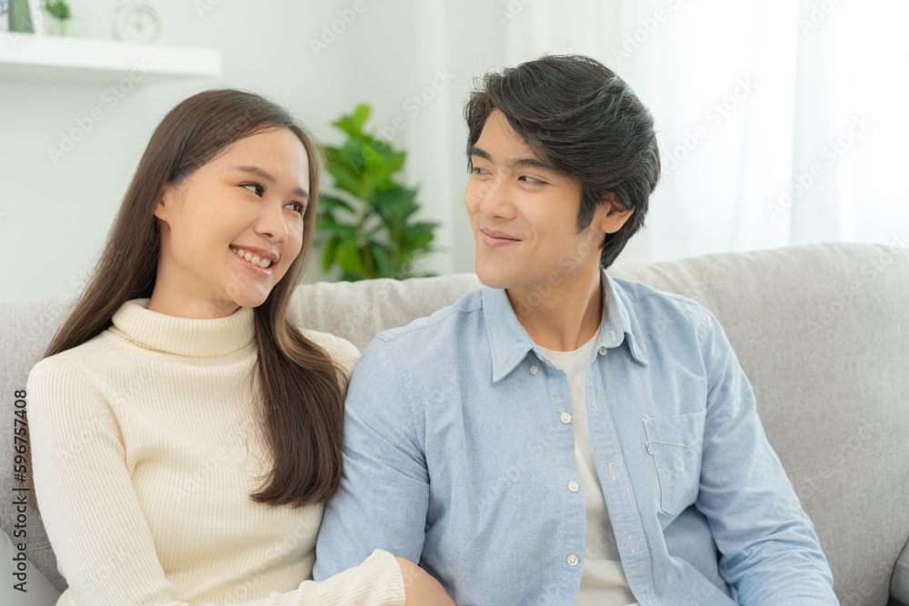 Asian couple smile and happy looking each other's eyes, cuddling, warm hugs, teenager's first love, married couple, warm family. Husband and wife in love so fun in new years eve or valentine day. Asian couple smile and happy looking each other's eyes, cuddling, warm hugs, teenager's first love, married couple, warm family. Husband and wife in love so fun in new years eve or valentine day.