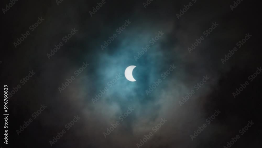 Solar eclipse through running clouds Solar eclipse through running clouds