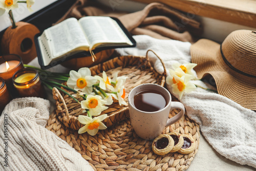 Bible, flowers, cup of tea. Christian good morning concept
