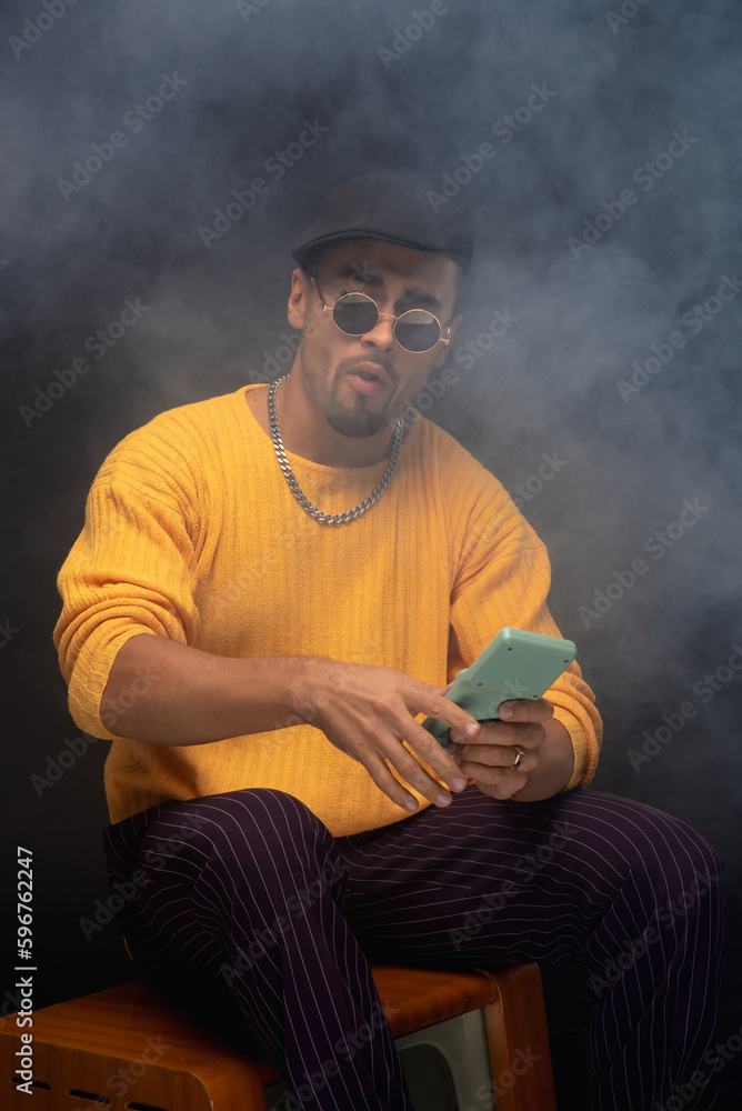 man in retro clothes with Tetris game