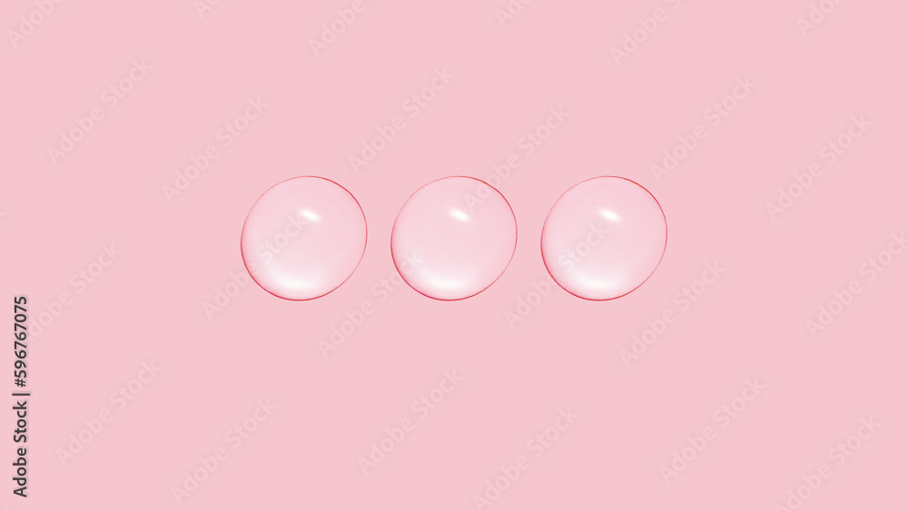Drops of transparent gel or water in a row. On a pink background.