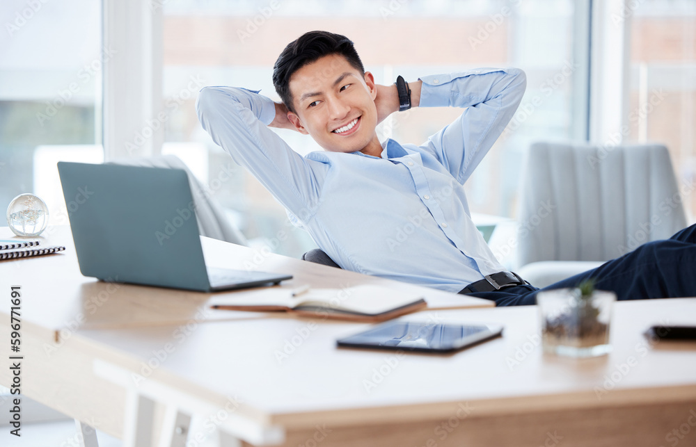 Let your work do the talking. Shot of a young businessman resting while working in a modern office.