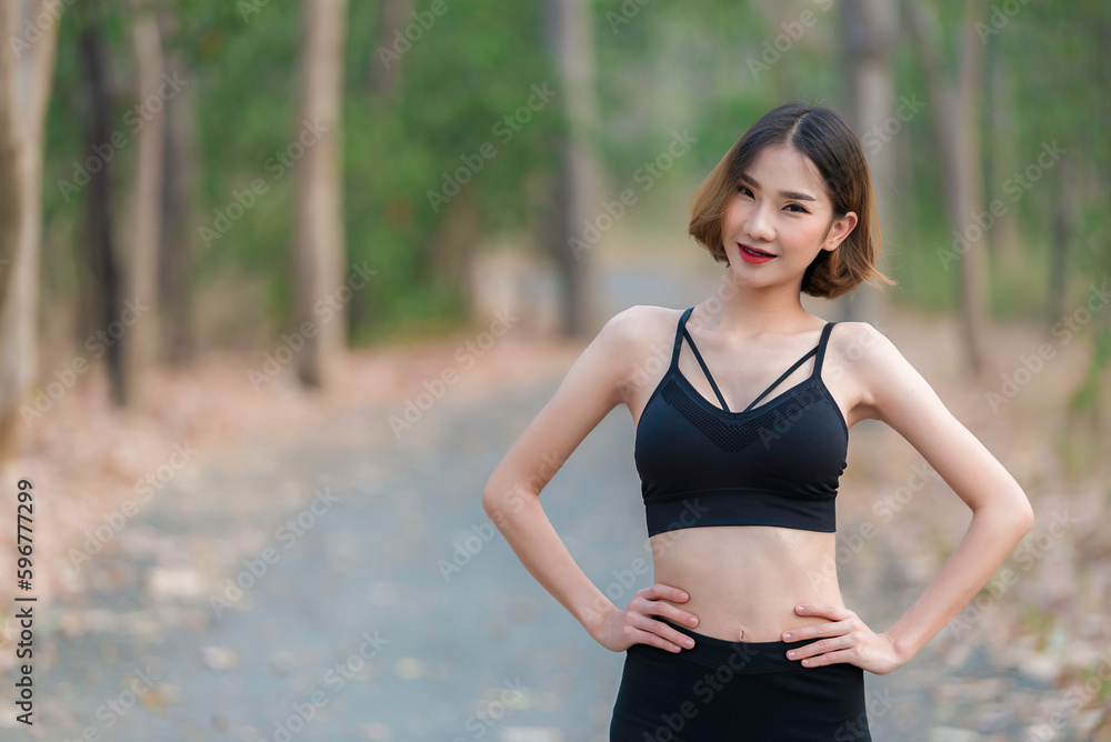 Asian beautiful slim woman at the park,Young girl love healthy exercise,Teen wear sportswear Asian beautiful slim woman at the park,Young girl love healthy exercise,Teen wear sportswear
