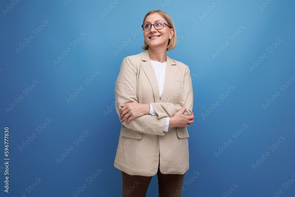 portrait of a successful business 40s mature lady in a classic jacket on a bright background with copy space portrait of a successful business 40s mature lady in a classic jacket on a bright background with copy space