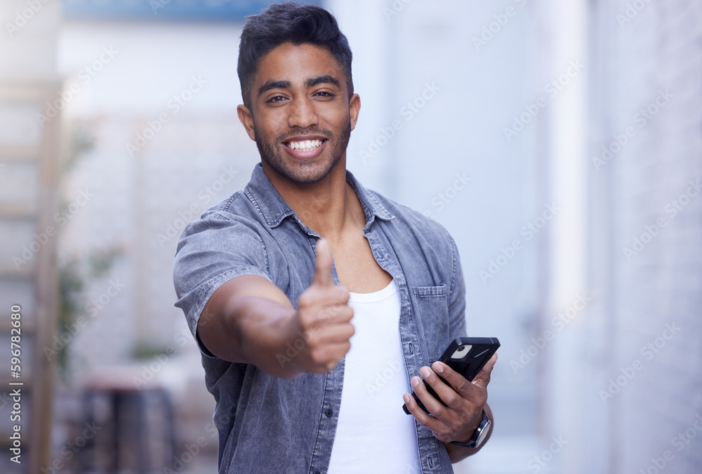 Its perfect. Cropped portrait of a handsome young man giving a thumbs up in studio.