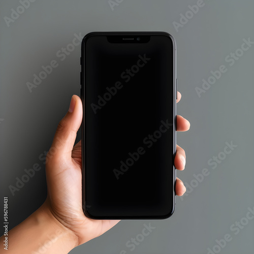 phone in hand, dark background