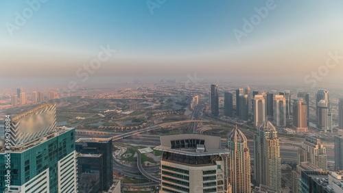 Panorama of Dubai Marina with JLT skyscrapers and golf course timelapse, Dubai, United Arab Emirates. photo